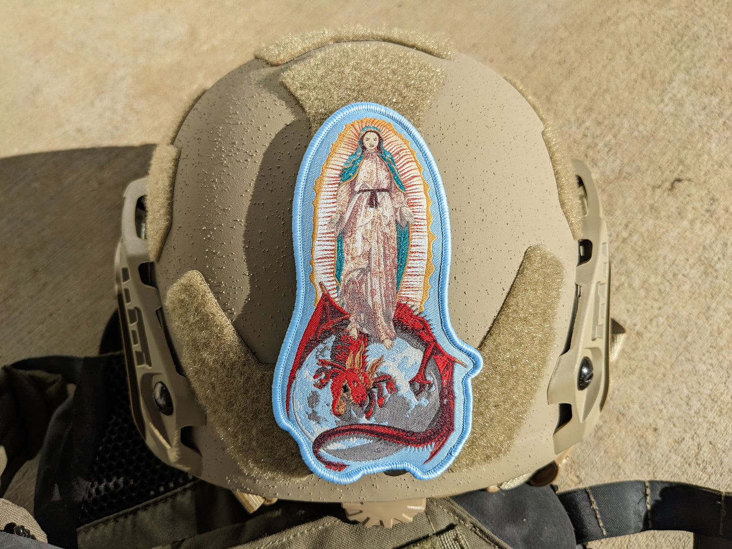 helmet with patch depicting Our Lady of Guadalupe