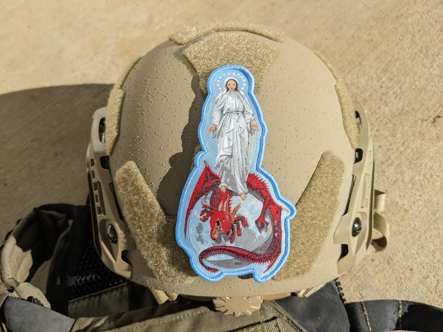 helmet with patch depicting the Blessed Virgin Mary