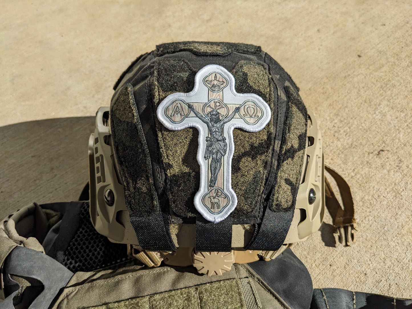 Helmet with white crucifix patch