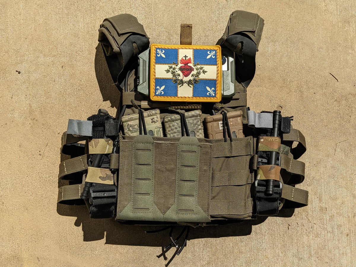 Sacred Heart of Jesus flag patch on a vest.