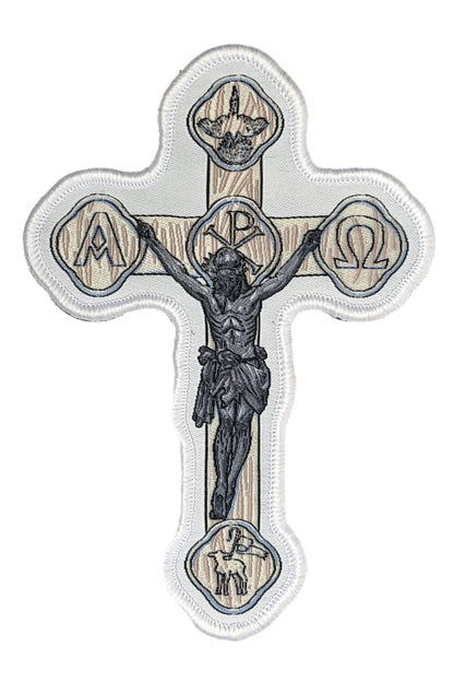 Woven patch with velcro hook backing depicting a white crucifix.