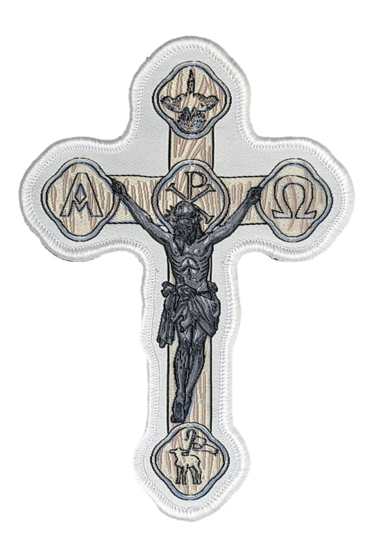 Woven patch with velcro hook backing depicting a white crucifix.